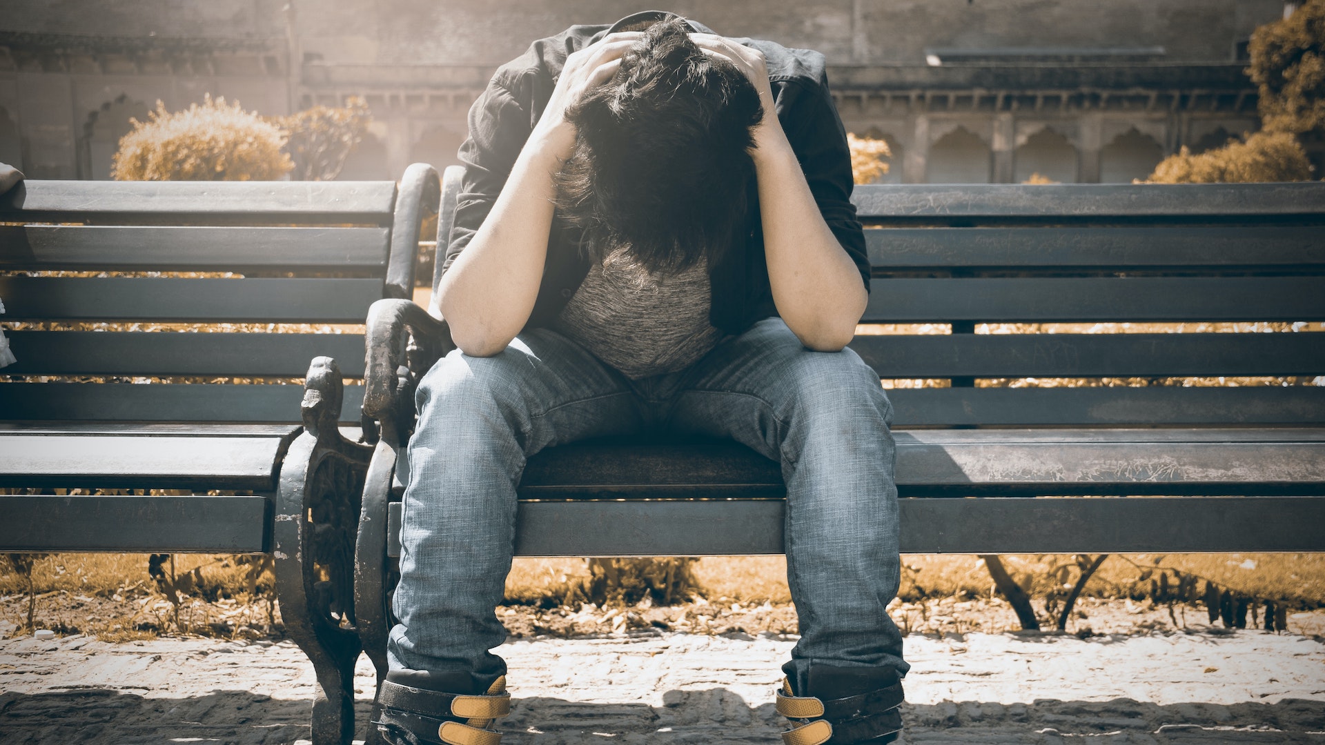 a man sitting on a bench